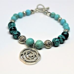 Beaded turquoise bracelet with flower charm